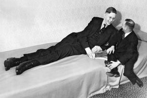 Robert Wadlow was already 8 feet, 7 inches tall at the young age of 19 in this photo — and he hadn’t stop growing yet.